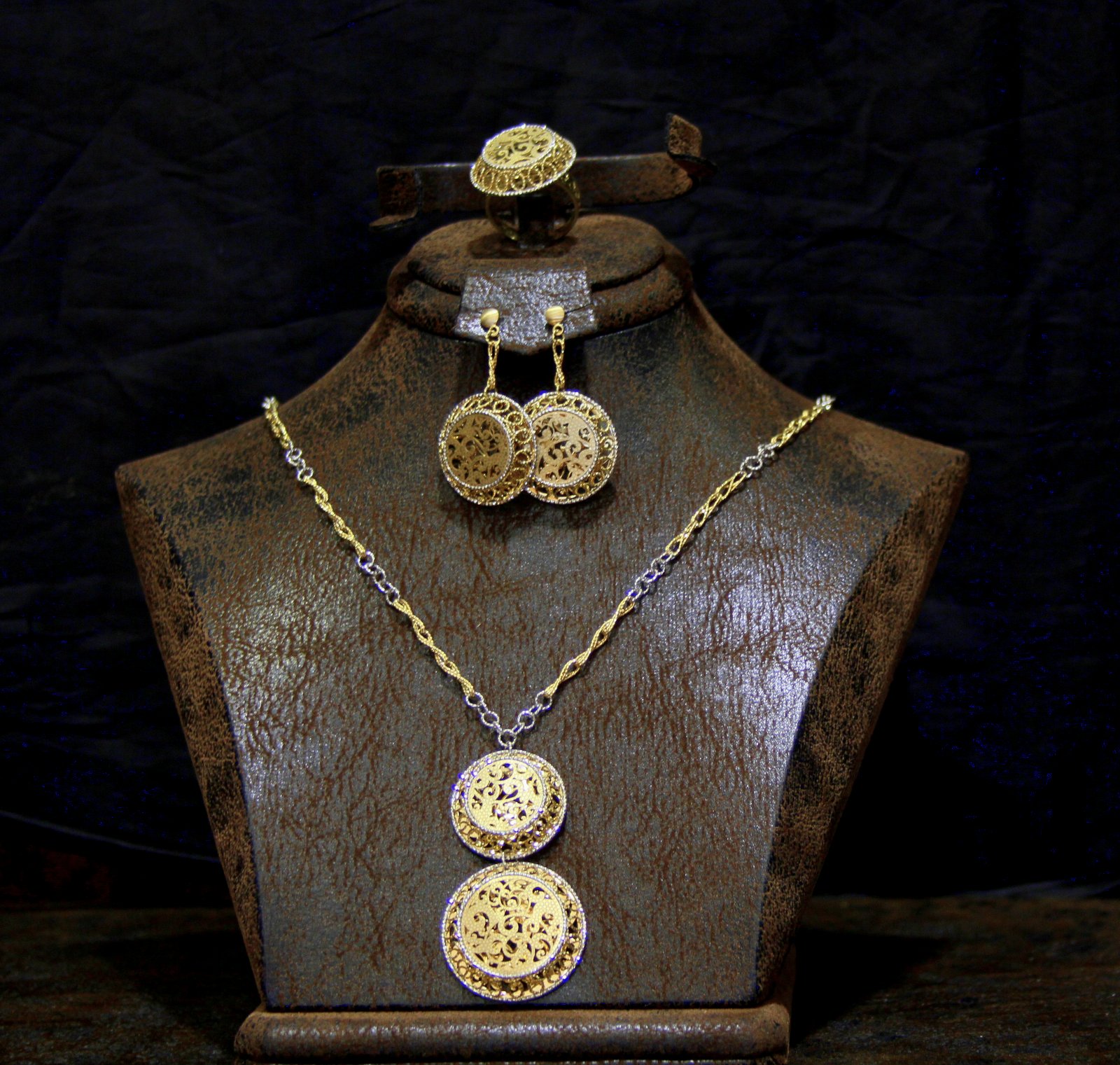 Gold Filigree Necklace and Earrings on a Bust