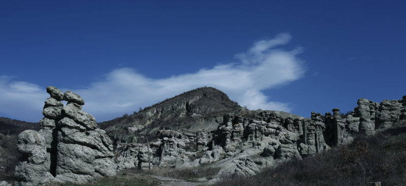 Tall Rock Formations Under a Blue Sky