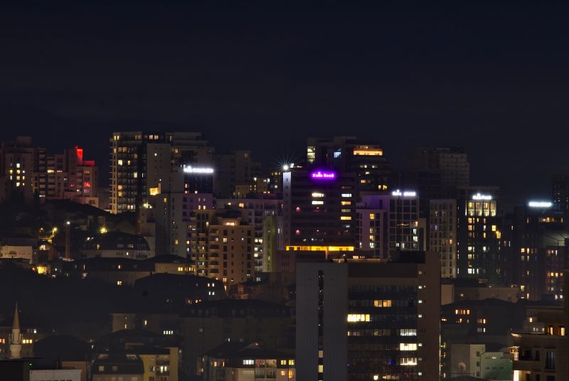 City Skyline with Lit Towers at Night