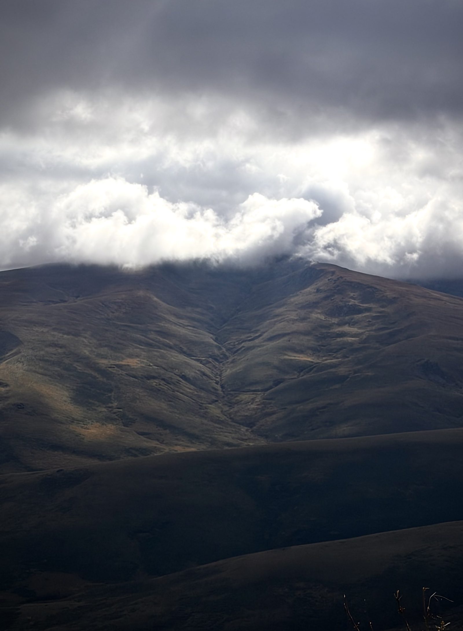 Dark Mountain Under Heavy Clouds