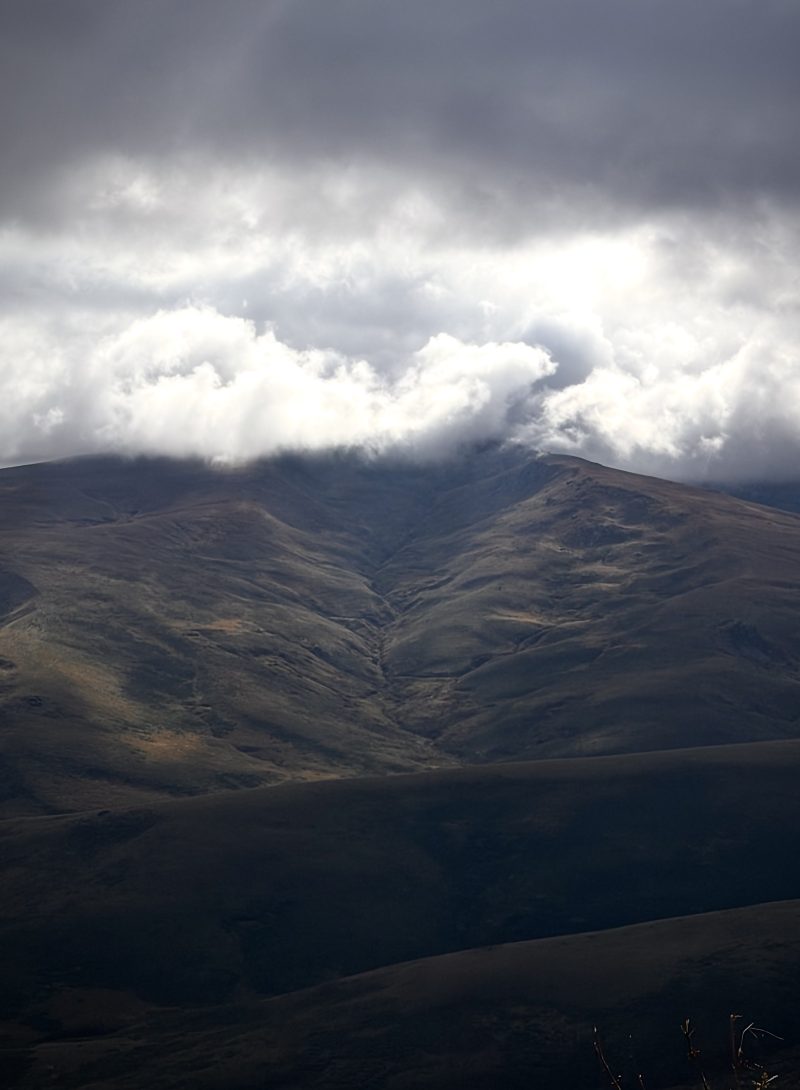 Dark Mountain Under Heavy Clouds