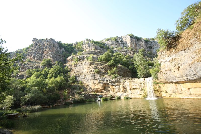 Canyon Lake Fed by a Small Waterfall
