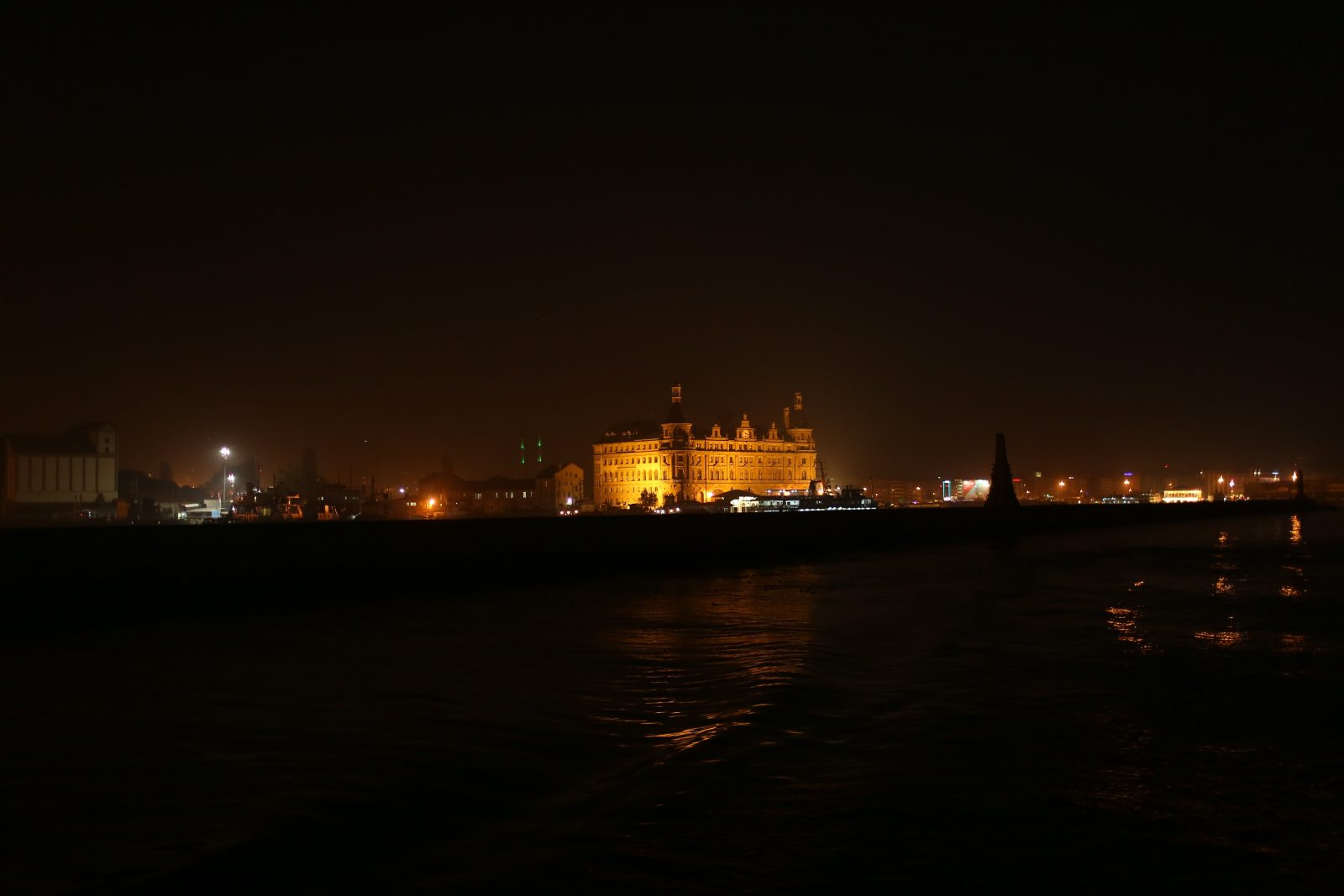 Illuminated Historic Building Across the Water