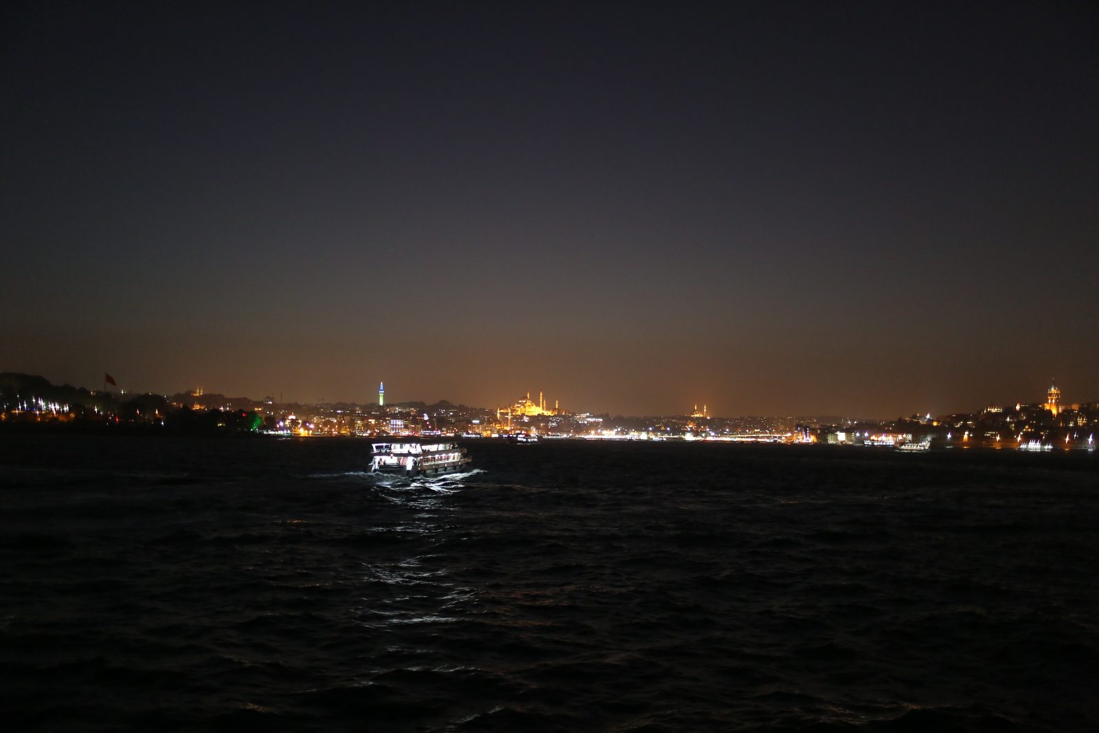 Istanbul Skyline and a Ferry at Night