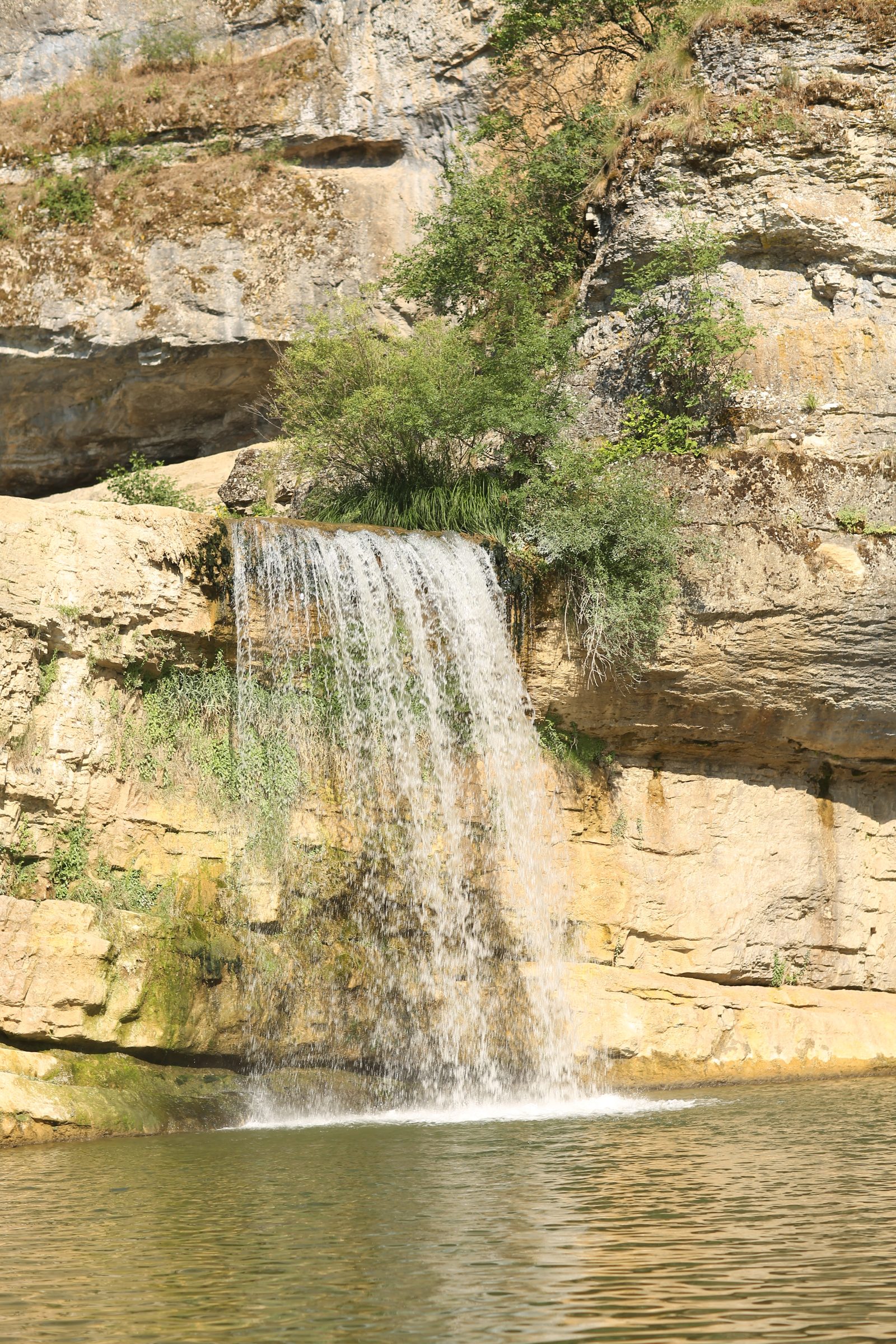 Waterfall Pouring into a Canyon Pool