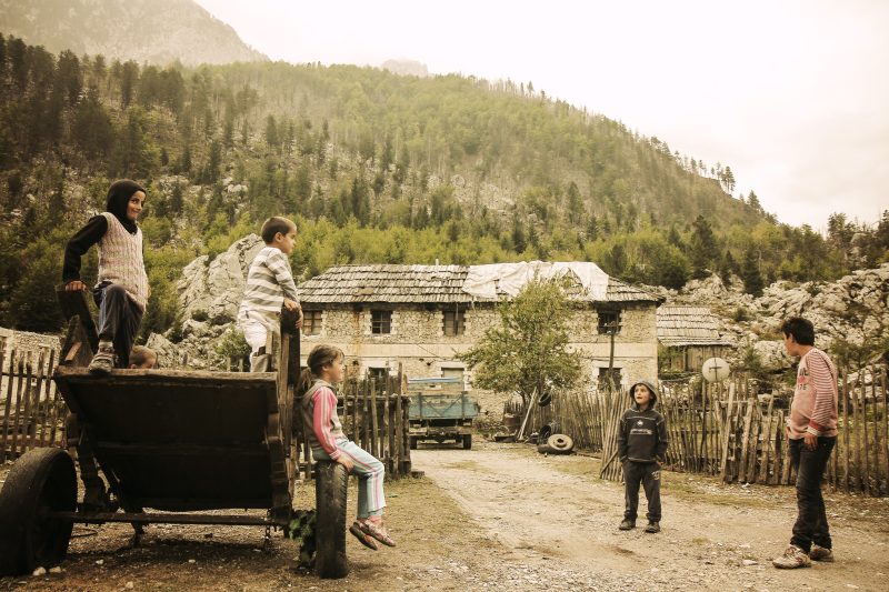 Children Playing on a Cart in Valbona Village