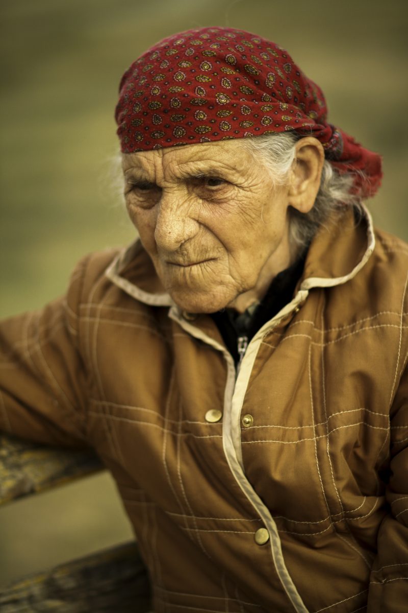 Portrait of an Elderly Woman in a Red Headscarf
