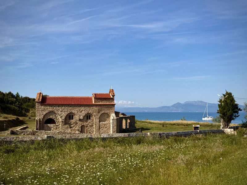 Old Stone Building on a Grassy Hill by the Sea