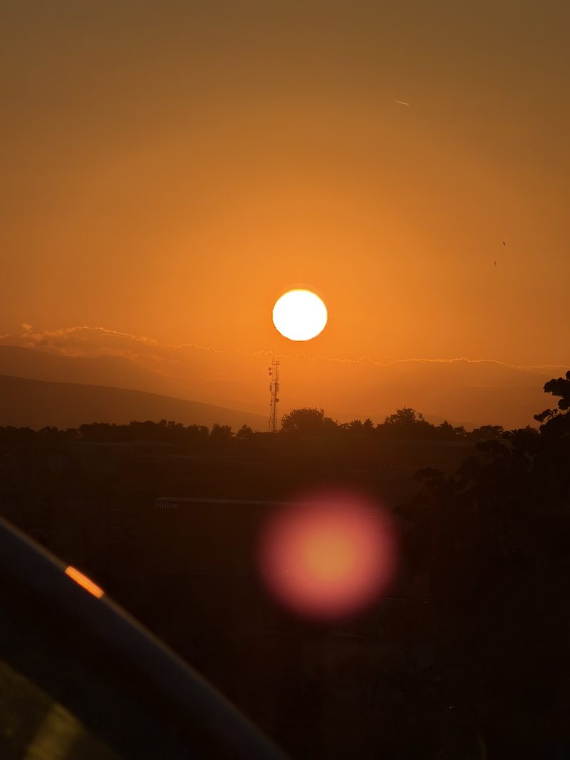 Orange Sunset Over a Dark Treeline