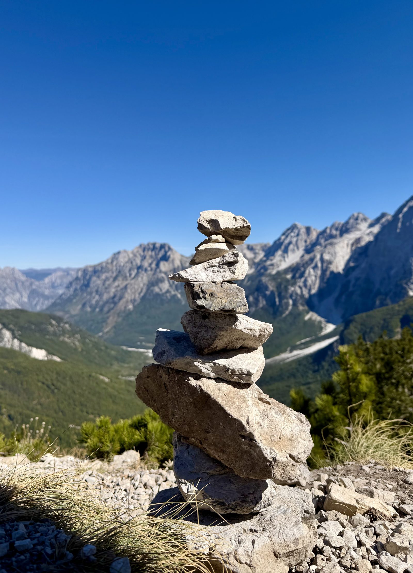 Stone Cairn in Front of Rocky Mountains