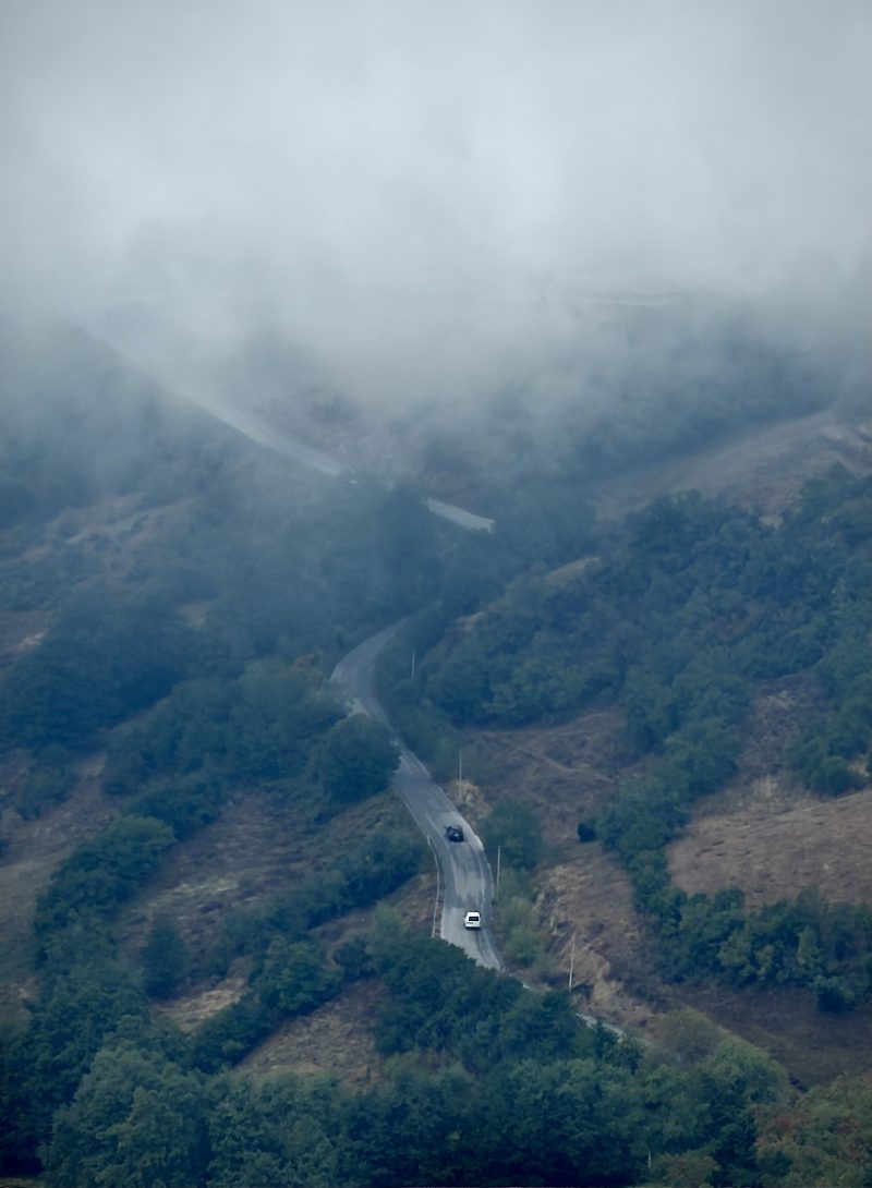 Winding Mountain Road in Fog